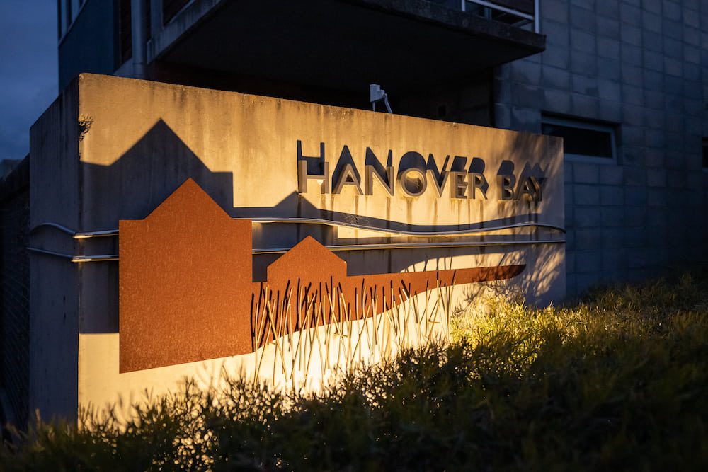 The Hanover Bay sign lit up at night